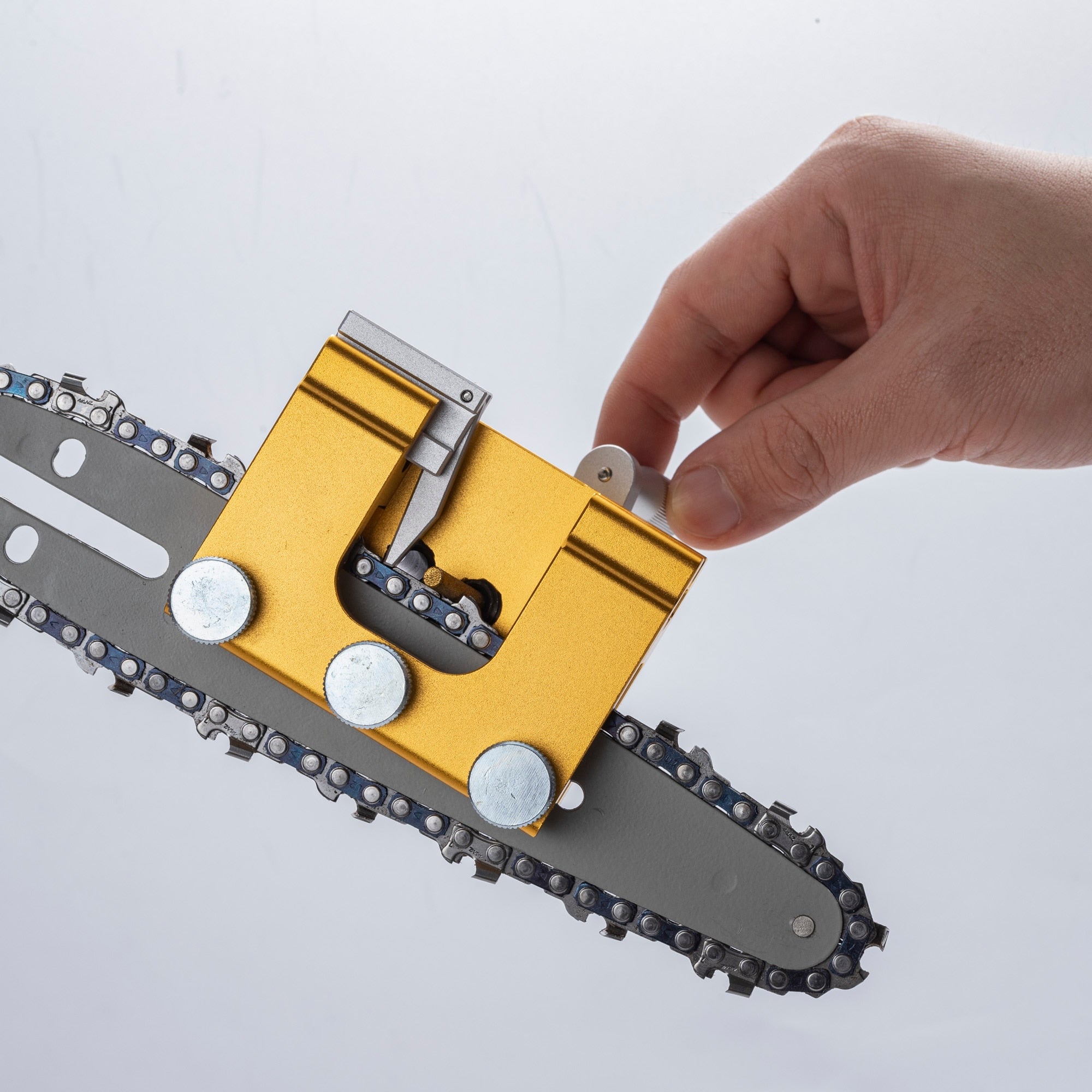 Portable chainsaw sharpener tool