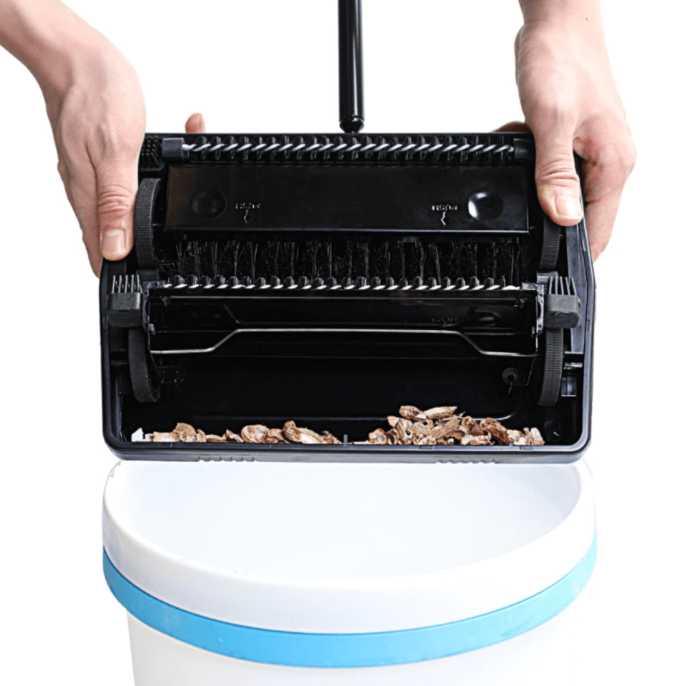 Manual carpet and floor sweeper